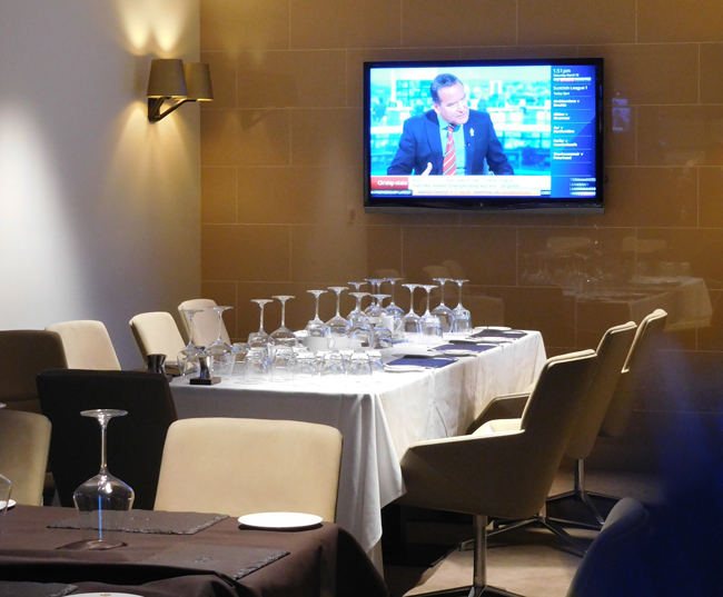 The owner's table in the swanky restaurant and bar, letting him mingle with the moneyed supporters pre-game.