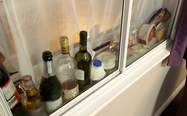 Hotel fridge in the window cavity. Necessity breeds invention.