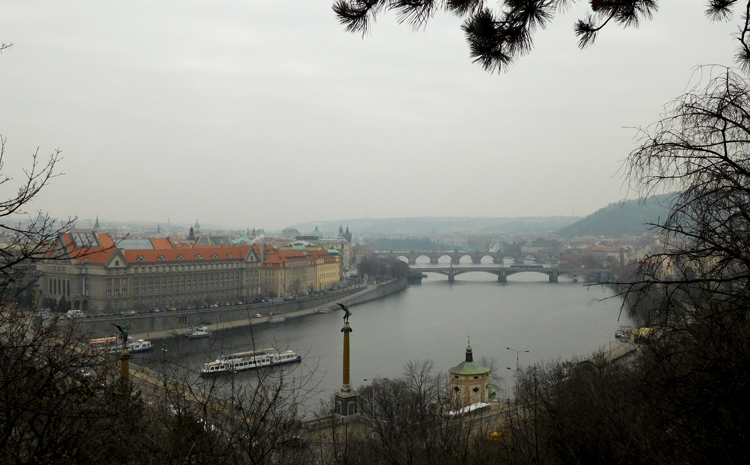 Views over Old Town and the Vltava River, crossed by her many bridges, including Charles Bridge with its statues, from Letná Park.