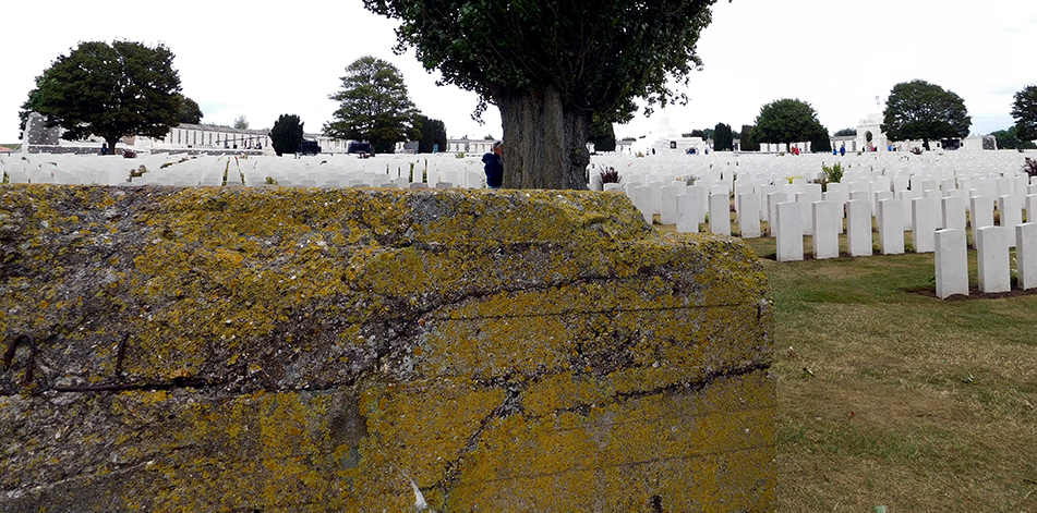 A German pillbox, pockmarked by bullet and artillery fire now stands sentinel in Tyne Cot Cemetery